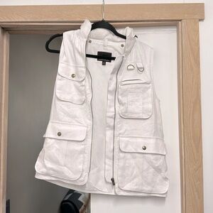 White utility vest. Lots of pockets. Linen and lightweight.